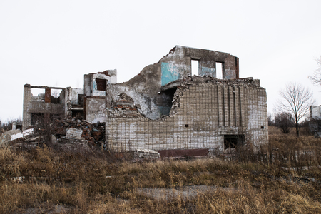 Old destroyed an abandoned multi-storey building in a military town where nobody livesの写真素材