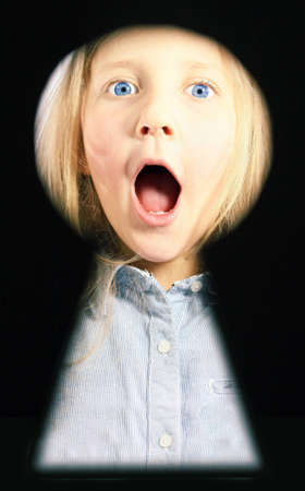 portrait of surprised girl in the lock slotの写真素材