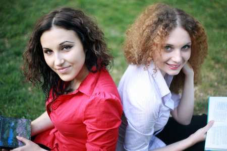 girlfriend reading on the natureの写真素材