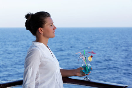 pretty woman with a cocktail on a summer day