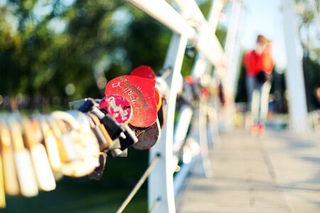 symbols of eternal love, abandoned on a bridge loversの写真素材