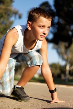 boy at the start before running in the parkの写真素材