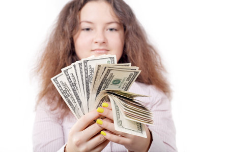 girl counts the money on an isolated white background