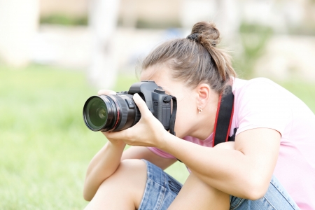 woman photographer at work a summer dayの写真素材