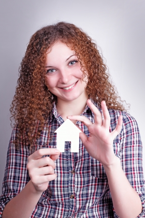 pretty curly girl builder with their dream house の写真素材