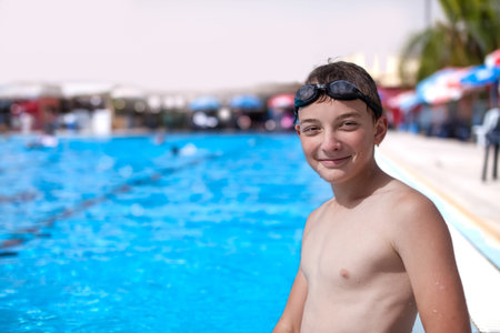 the guy is resting after a swim in the pool
