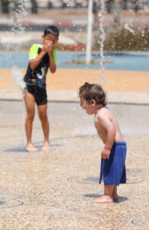 a jet of water at different effect on peopleのeditorial素材