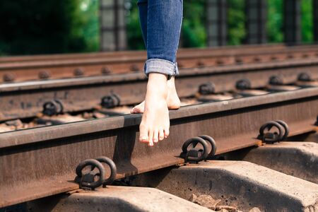 feet on the railroad close-up summer dayの写真素材