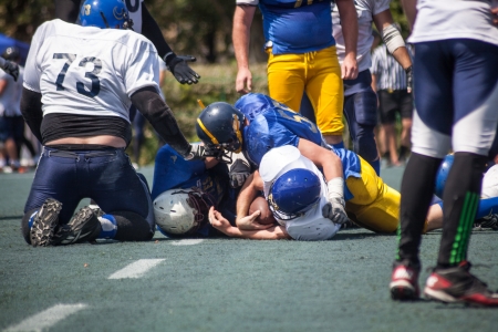 KHARKOV/UKRAINE - 7 JULY 2013: American football match between the teams of Ukrainian "Atlanta" against the "Scythians". Rugby 7 july Ukraine.のeditorial素材