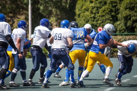 KHARKOV/UKRAINE - 7 JULY 2013: American football match between the teams of Ukrainian "Atlanta" against the "Scythians". Rugby 7 july Ukraine.のeditorial素材