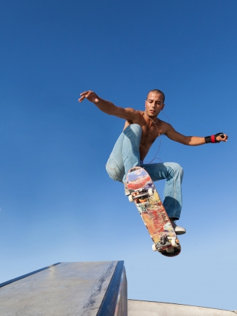 boy flying on a skateboard, sport backgroundの写真素材
