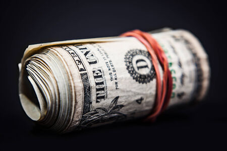 money roll close up in dark backgroundの写真素材