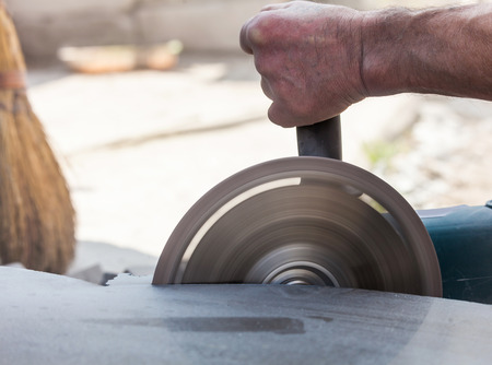 cutting stone grinder, work backgroundの写真素材