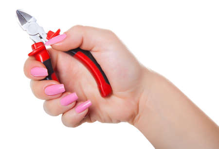 combination pliers in hand, isolated white backgroundの写真素材