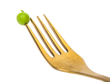 pea beans on a fork, vegetables backgroundの写真素材