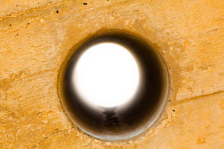 stone wall with a circle in the middleの写真素材