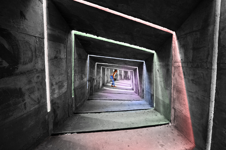 girl stands in the architectural construction of the monumentの写真素材