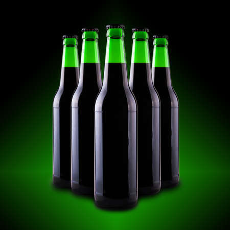 beer in glass bottles on a dark backgroundの写真素材