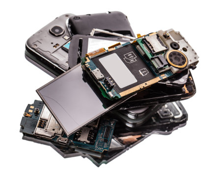 many broken phones closeup on a light background