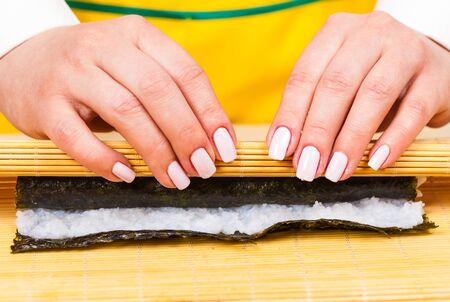 cook hands twisted rolls on a wooden boardの写真素材