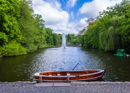 lake with fountain and boat in the park of Sophiaの写真素材