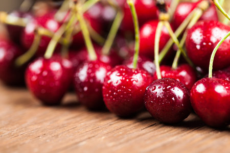 juicy ripe cherry closeup on wooden background