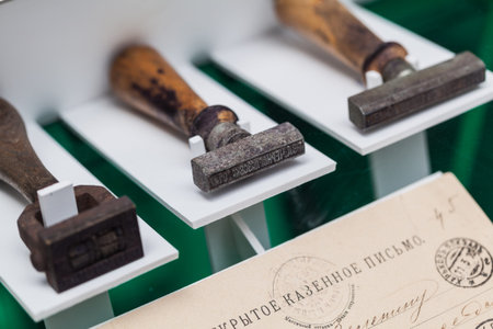 Three ancient metal printing with wooden handle