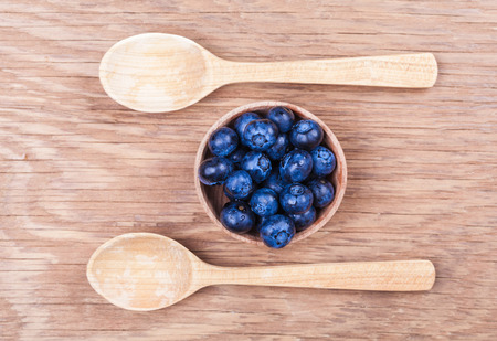 natural fresh blueberries closeup on wooden backgroundの写真素材