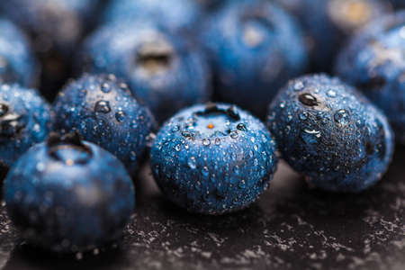natural fresh blueberries closeup on dark backgroundの写真素材