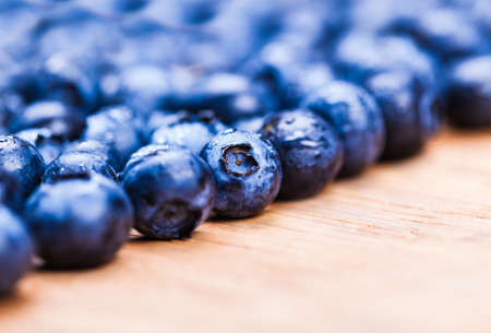 natural fresh blueberries closeup on wooden backgroundの写真素材