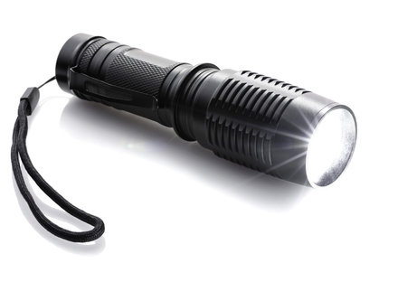 luminous black flashlight isolated on a white background