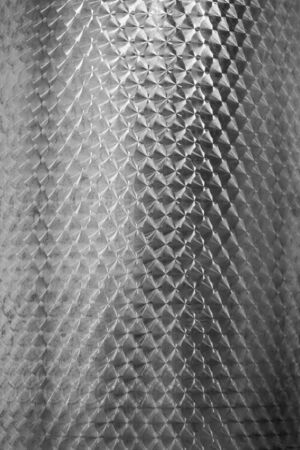 the abstract background texture of silver foilの写真素材