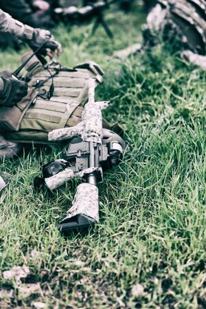 military weapon rifle close-up on green grassの写真素材