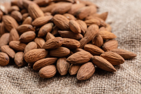 the natural almonds closeup on vintage backgroundの写真素材