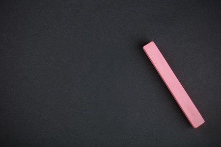 red chalk close-up against the black backgroundの写真素材