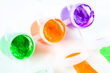 set of colorful paints close-up on white backgroundの写真素材