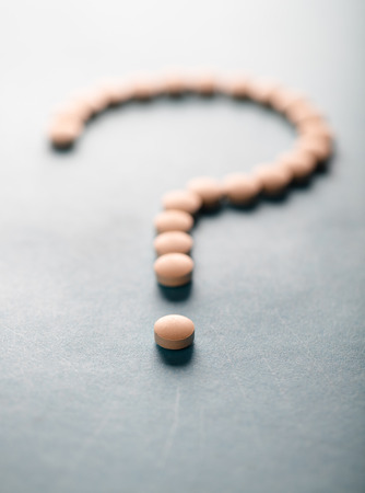 pills in the form of question markの写真素材