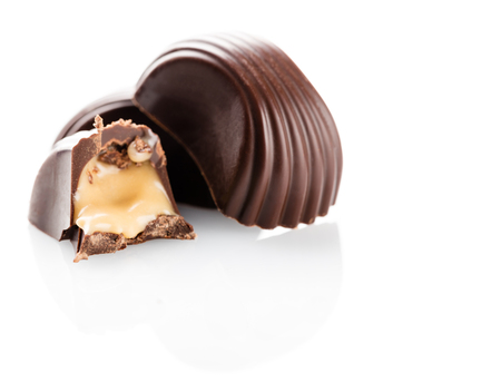 chocolate sweets closeup on a white background isolatedの写真素材