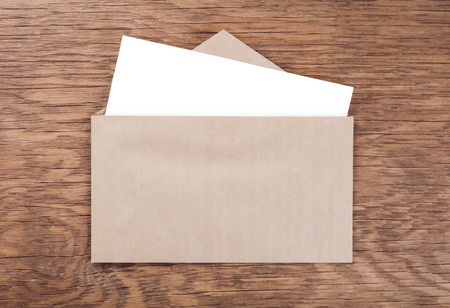envelope whit blank on  wooden tableの写真素材