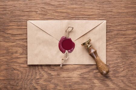 envelope with a stamp on the wooden backgroundの写真素材