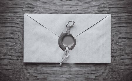 envelope with a stamp on the wooden backgroundの写真素材