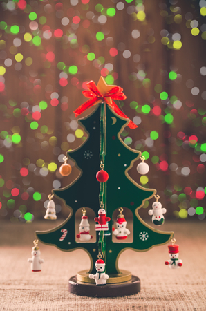 decorative Christmas tree on a background colored lightsの写真素材