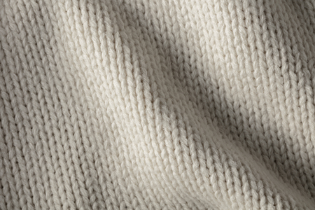 the abstract background texture of a knitted fabricの写真素材