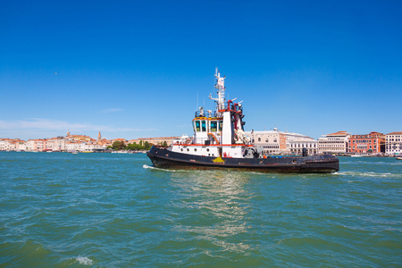  Boat floating from the island of San Giorgio, Venice, Italyの写真素材