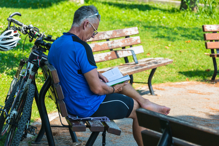 PADUA, ITALY - August 5, 2016: Piazza of Prato della Valle, Padova, Italy.Man reading book.のeditorial素材
