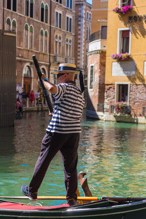 VENICE, ITALY - AUGUST 7 2016: Male gondolier. Venice, Italyのeditorial素材