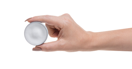 jar with lip cream in hand on white isolated backgroundの写真素材