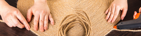 making handmade carpets from a rope close-up, photo collageの写真素材
