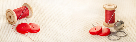 coils of colored thread, photo set on white knitted fabricの写真素材