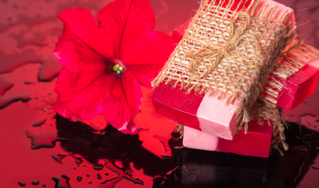 red flower soap handmade on a black backgroundの写真素材